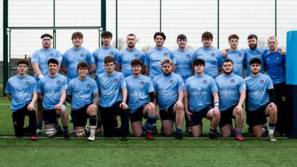 The University of Gloucester Men’s Rugby Union team at the training grounds in their Bishops Beds-branded training tops.