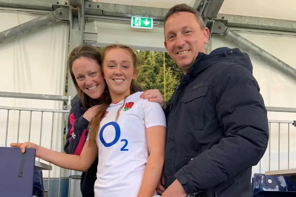 Anna in a white England rugby top.